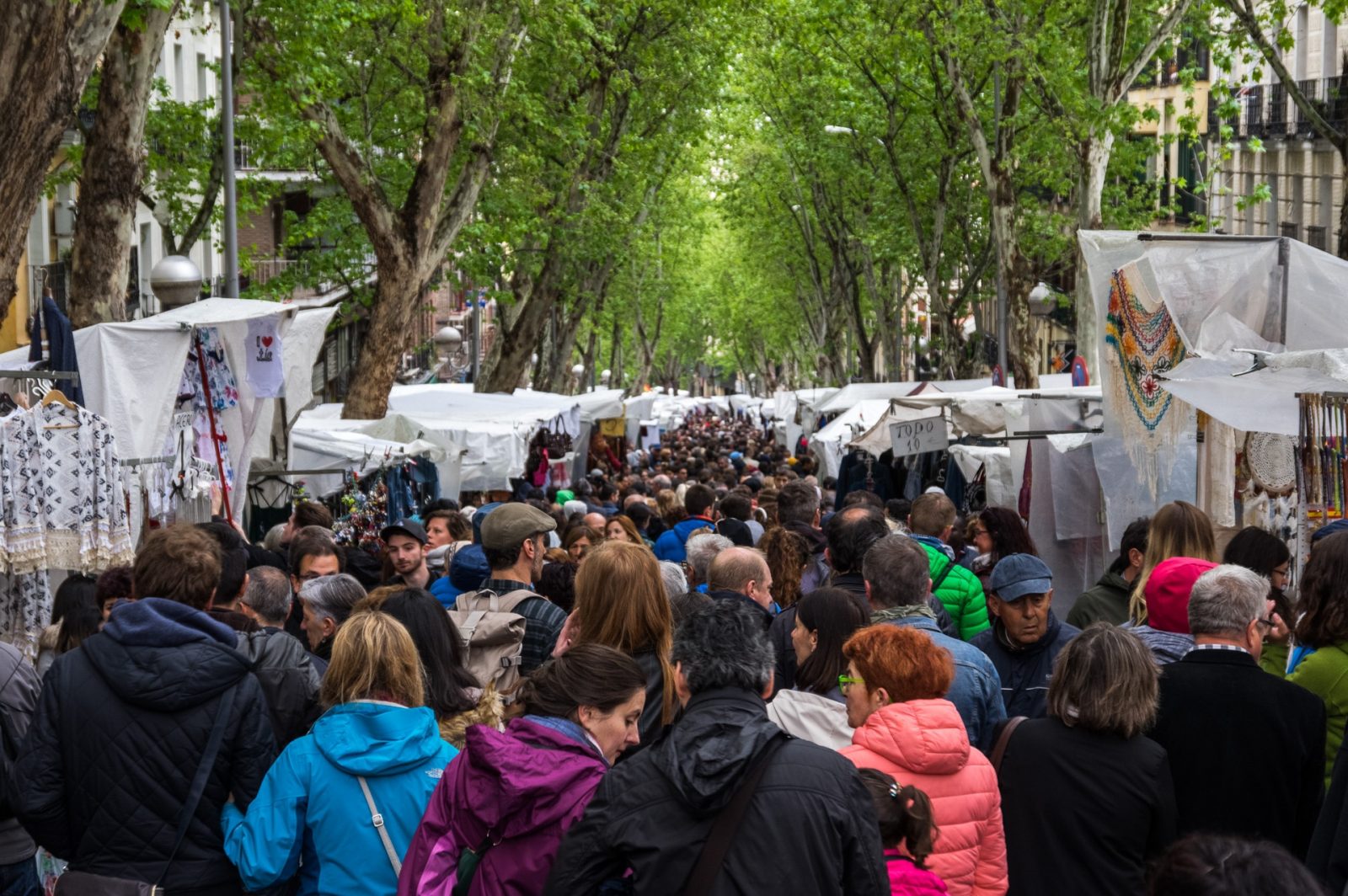 People walking on El Rastro's main street